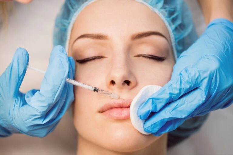 What are lip fillers- Aesthetician Lip Injection give a Woman